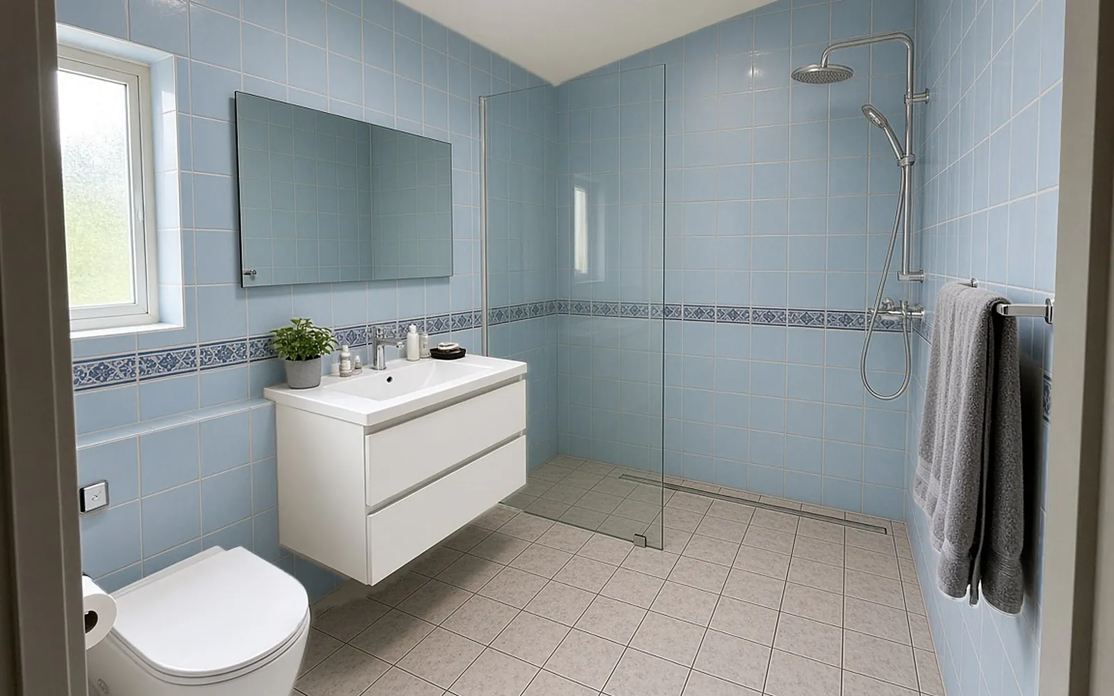HDB master bathroom before: dated pale blue wall tiles and beige floor tiles